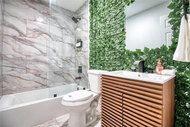 full bathroom featuring sink, tiled shower / bath combo, and toilet