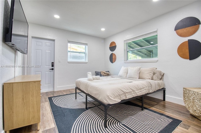 bedroom with light wood-type flooring