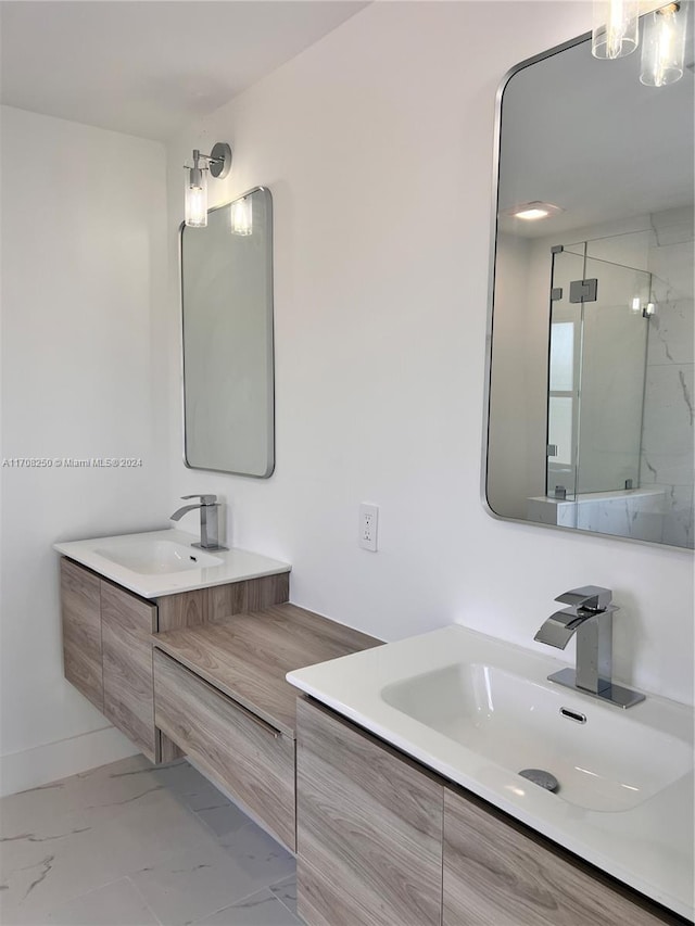 bathroom with vanity and an enclosed shower