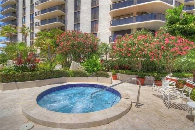 19667 Turnberry Way Unit 15A, Aventura, FL 33180 - view of pool featuring a hot tub