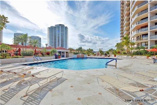 view of swimming pool featuring a patio