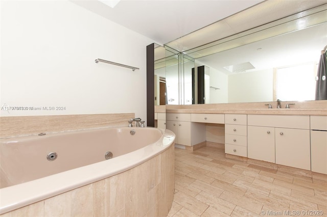 19667 Turnberry Way Unit 15A, Aventura, FL 33180 - bathroom featuring vanity and a jetted tub