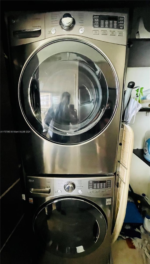 washroom with stacked washer / dryer