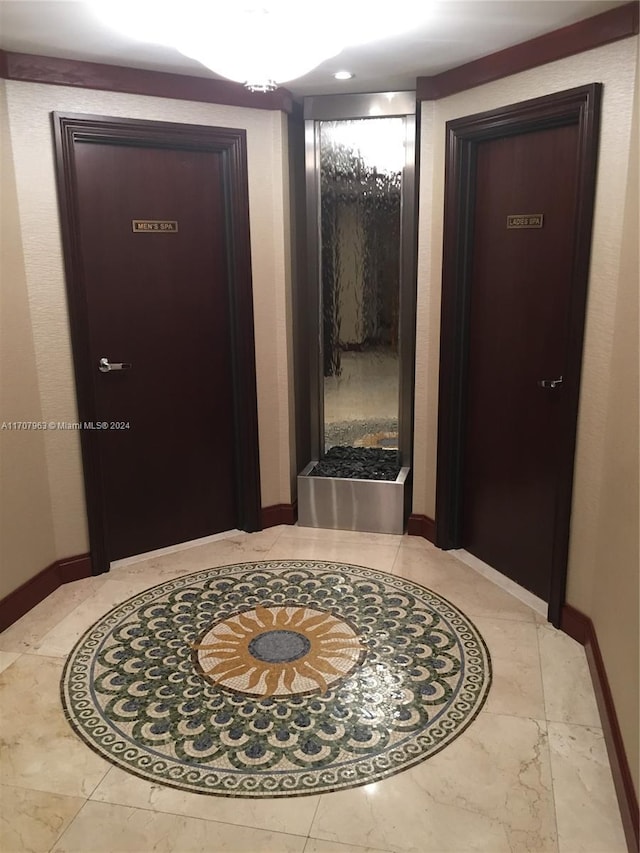 19667 Turnberry Way Unit 15A, Aventura, FL 33180 - hall featuring inlaid floor details and marble finish floors
