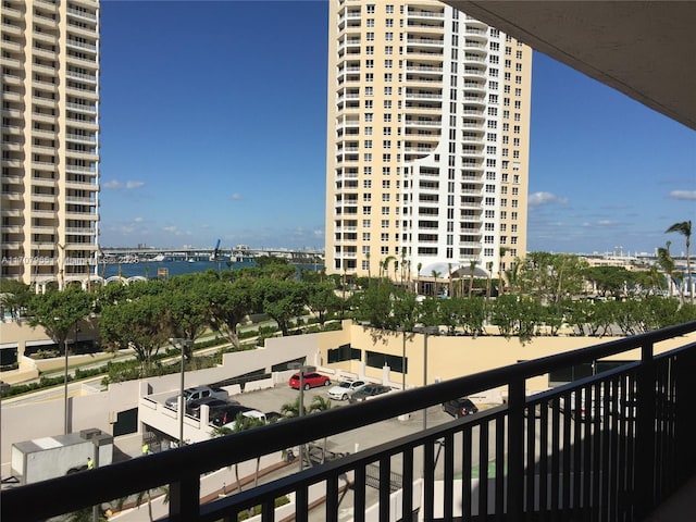 balcony featuring a water view