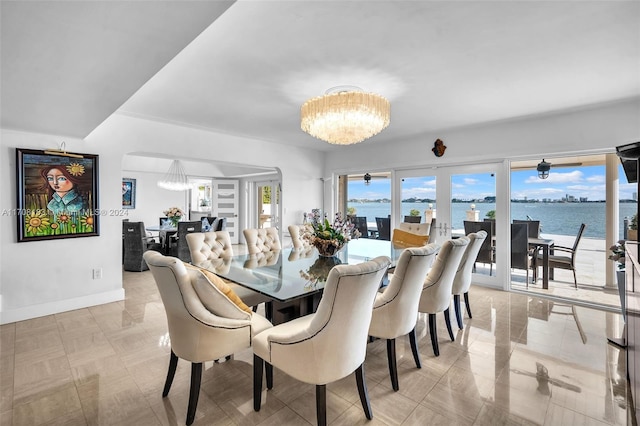 dining area featuring a notable chandelier