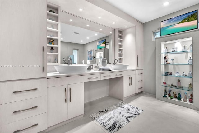 bathroom with concrete flooring and vanity