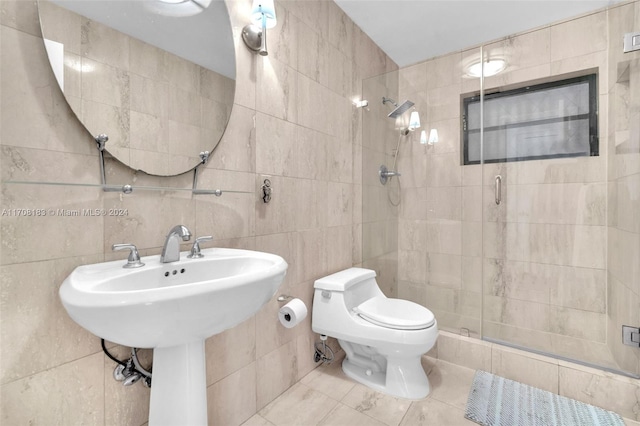 bathroom featuring tile patterned floors, toilet, tile walls, and walk in shower