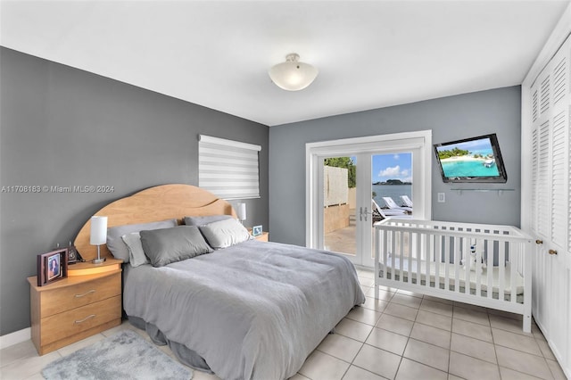 tiled bedroom featuring a closet