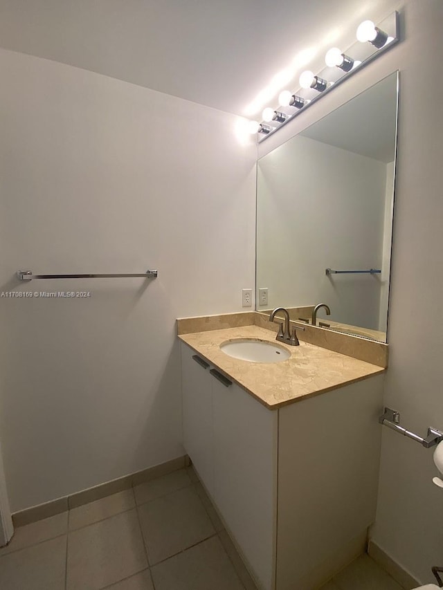 bathroom with tile patterned floors and vanity