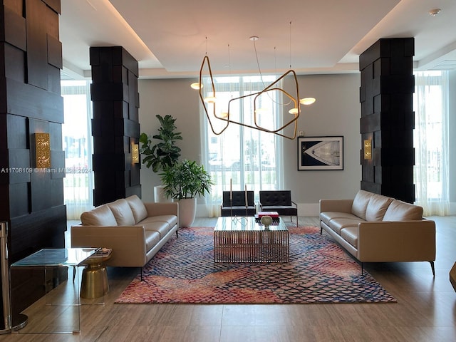 interior space featuring a chandelier, wood-type flooring, and a wealth of natural light