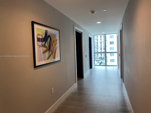 corridor featuring floor to ceiling windows