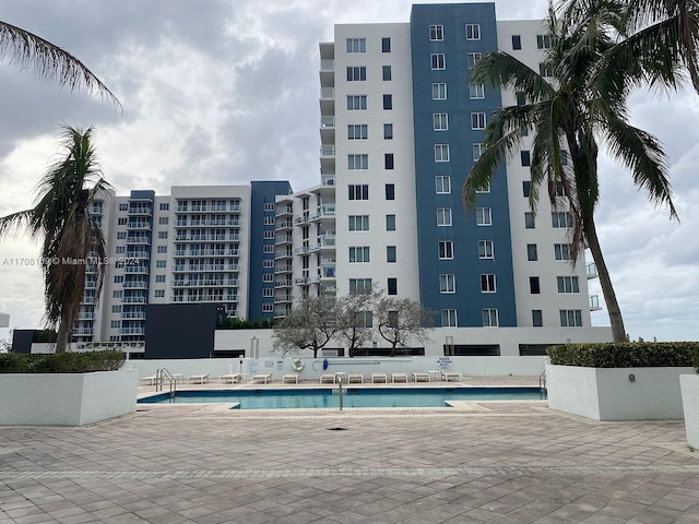 view of swimming pool with a patio area