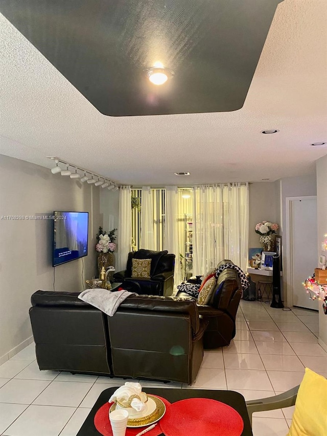 tiled living room with a textured ceiling