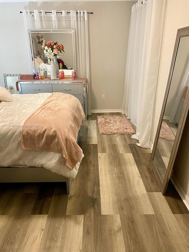 bedroom featuring hardwood / wood-style floors