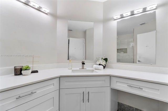 bathroom with vanity and an enclosed shower