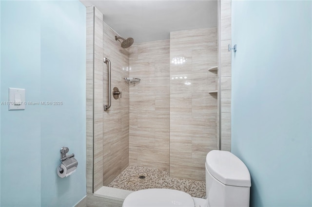 full bathroom with a stall shower and toilet