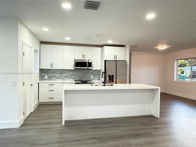 kitchen with sink, white cabinetry, and stainless steel appliances