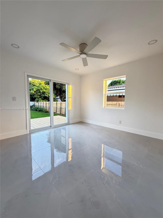 empty room with plenty of natural light and ceiling fan