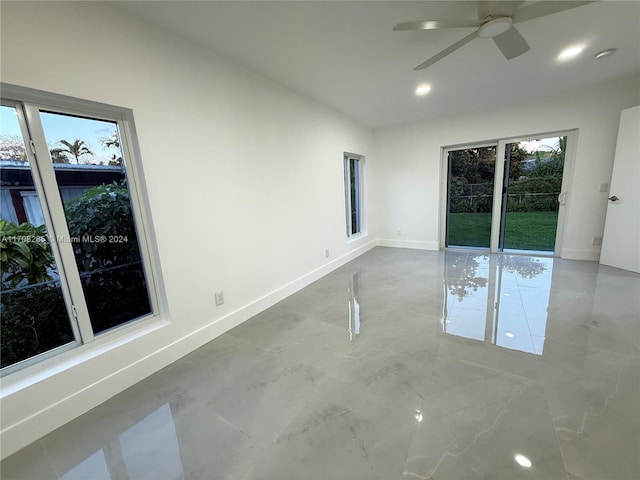 spare room with ceiling fan