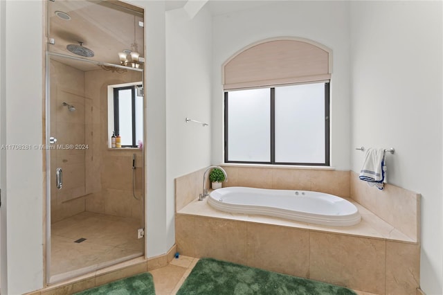 bathroom with tile patterned floors and separate shower and tub