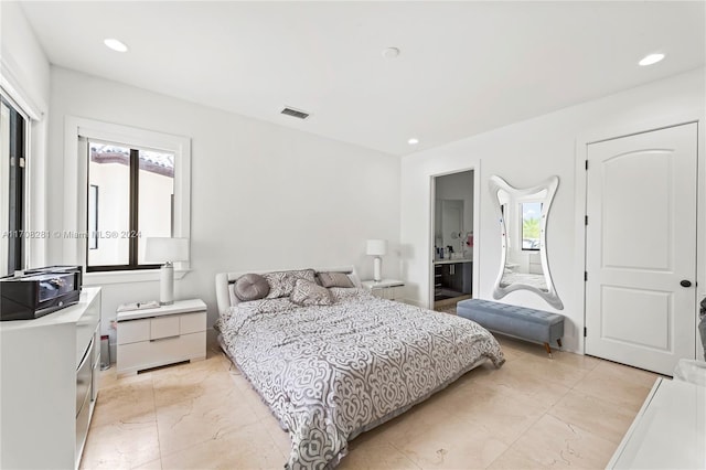 bedroom featuring connected bathroom