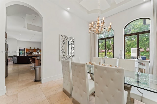 dining area with a chandelier and plenty of natural light