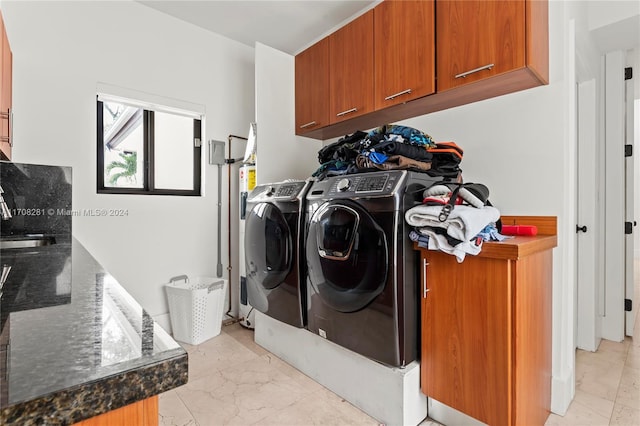 washroom featuring separate washer and dryer and sink