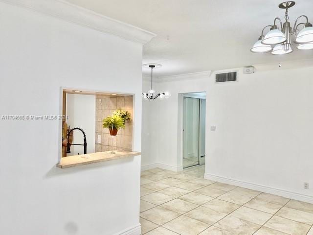 interior space with light tile patterned flooring, ornamental molding, decorative light fixtures, and a notable chandelier