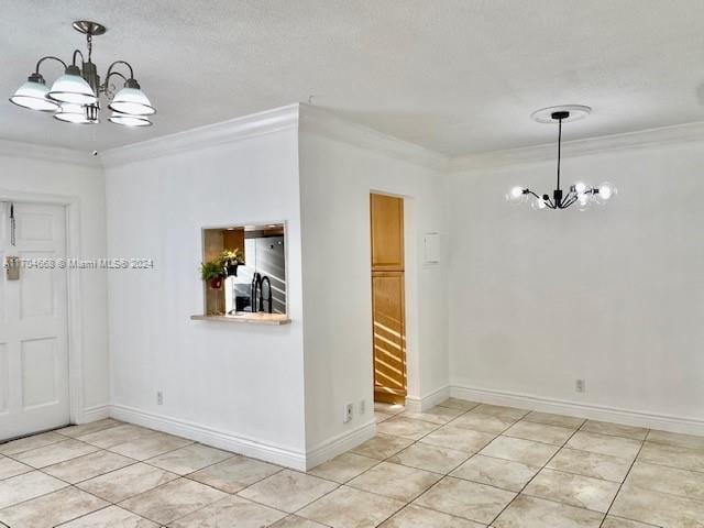 unfurnished dining area featuring a chandelier and ornamental molding