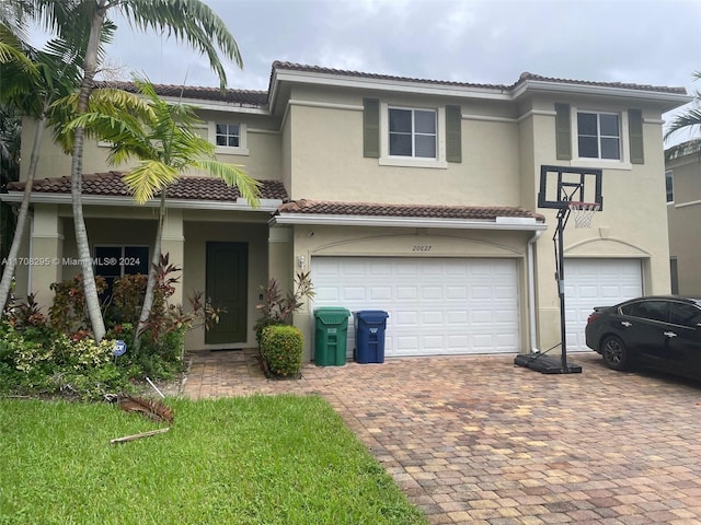 mediterranean / spanish-style home featuring a garage