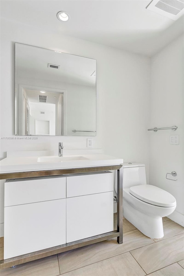 bathroom with vanity and toilet