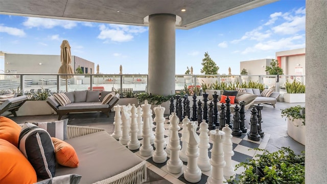 view of patio / terrace with a balcony and an outdoor hangout area