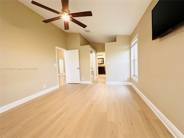 unfurnished living room featuring light wood-type flooring, ceiling fan, and high vaulted ceiling