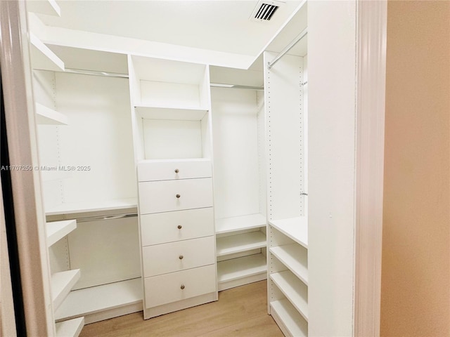 walk in closet featuring light wood-type flooring