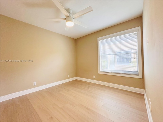 spare room featuring ceiling fan and wood-type flooring