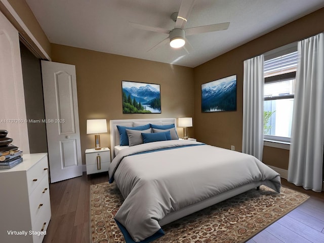 bedroom with ceiling fan and hardwood / wood-style flooring