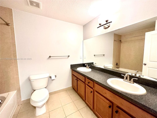 full bathroom with vanity, tile patterned floors, bathtub / shower combination, and a textured ceiling