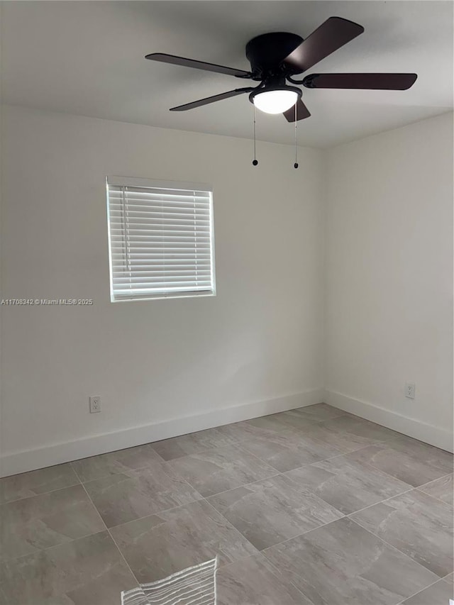 spare room with ceiling fan