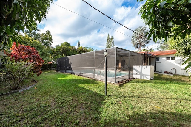 view of yard with a fenced in pool