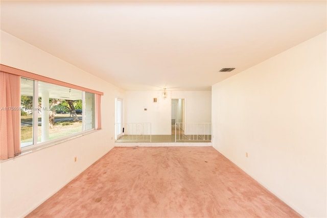 unfurnished room featuring carpet