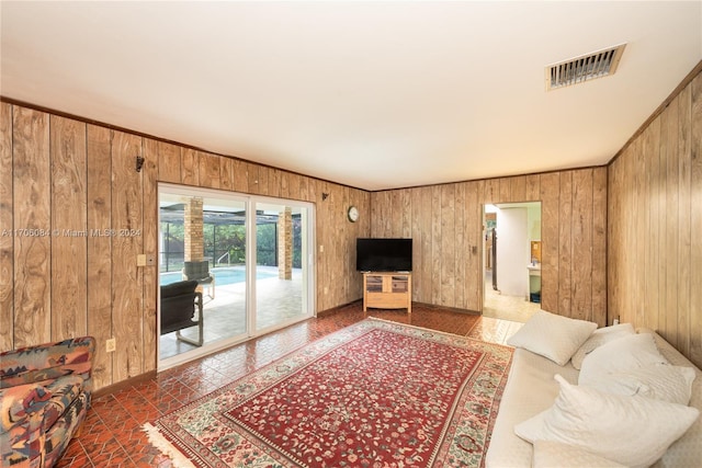 living room featuring wood walls