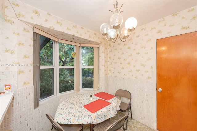 dining room with a chandelier and plenty of natural light