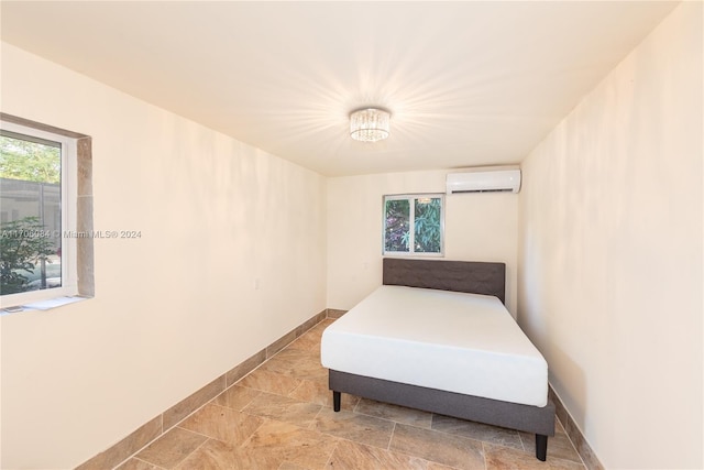 bedroom with a wall mounted air conditioner