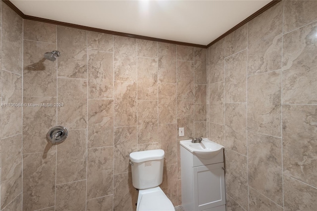 bathroom featuring crown molding, vanity, tile walls, and toilet