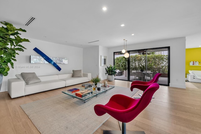 living room with light hardwood / wood-style flooring