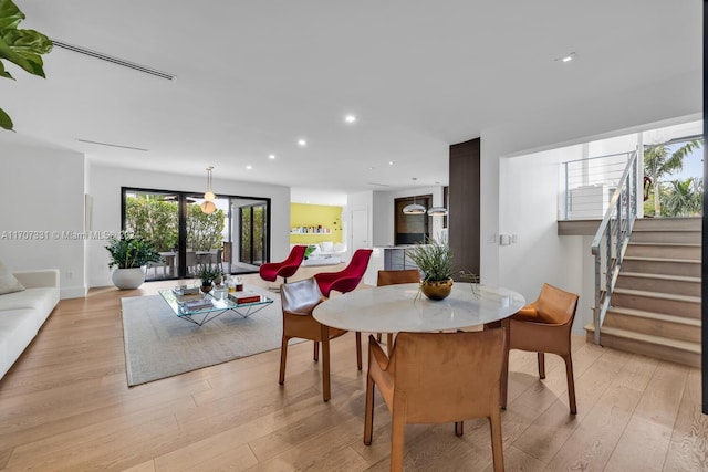 dining area with light hardwood / wood-style floors