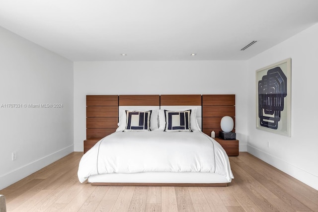 bedroom with light wood-type flooring