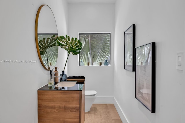 hall featuring hardwood / wood-style flooring and sink