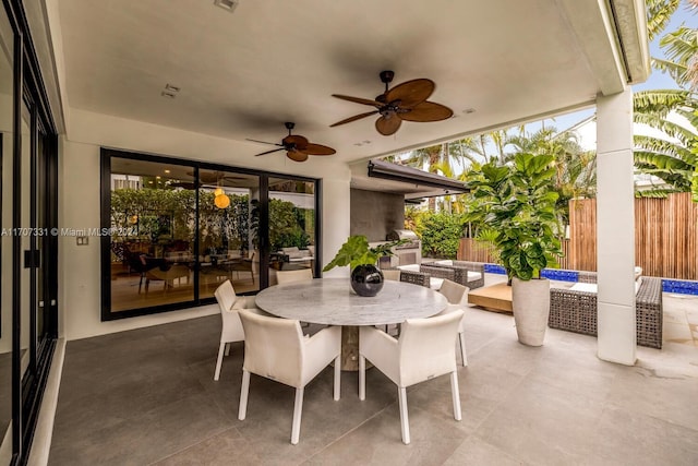 view of patio with ceiling fan and an outdoor living space